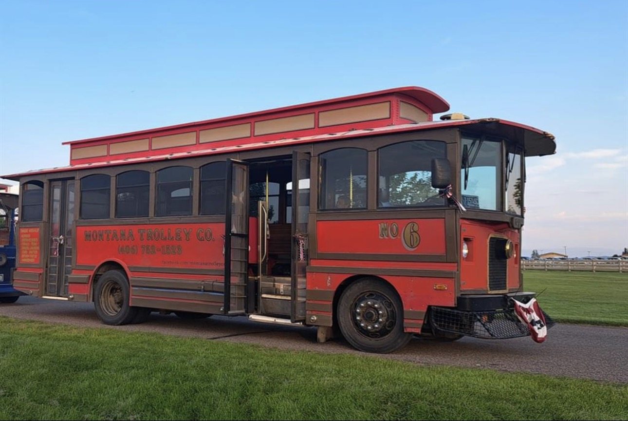Classic red Montana trolley under blue sky