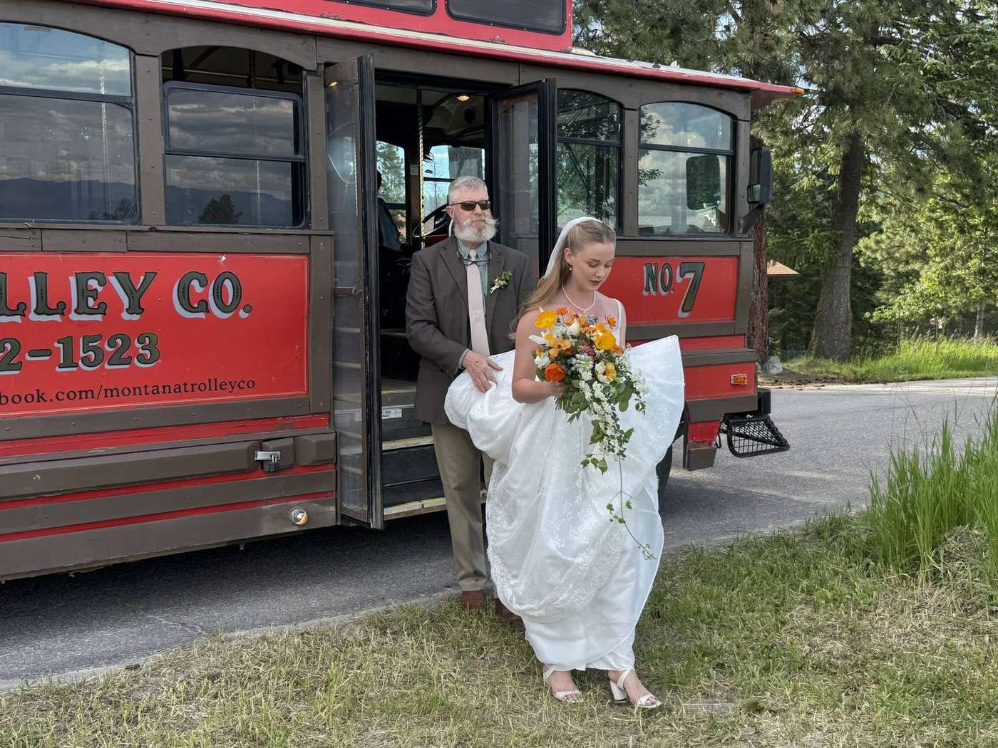 Bride stepping from a Montana trolley doorway