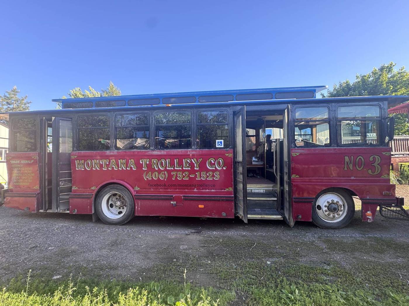 Sunlit Montana trolley with open door, restored and ready to ride